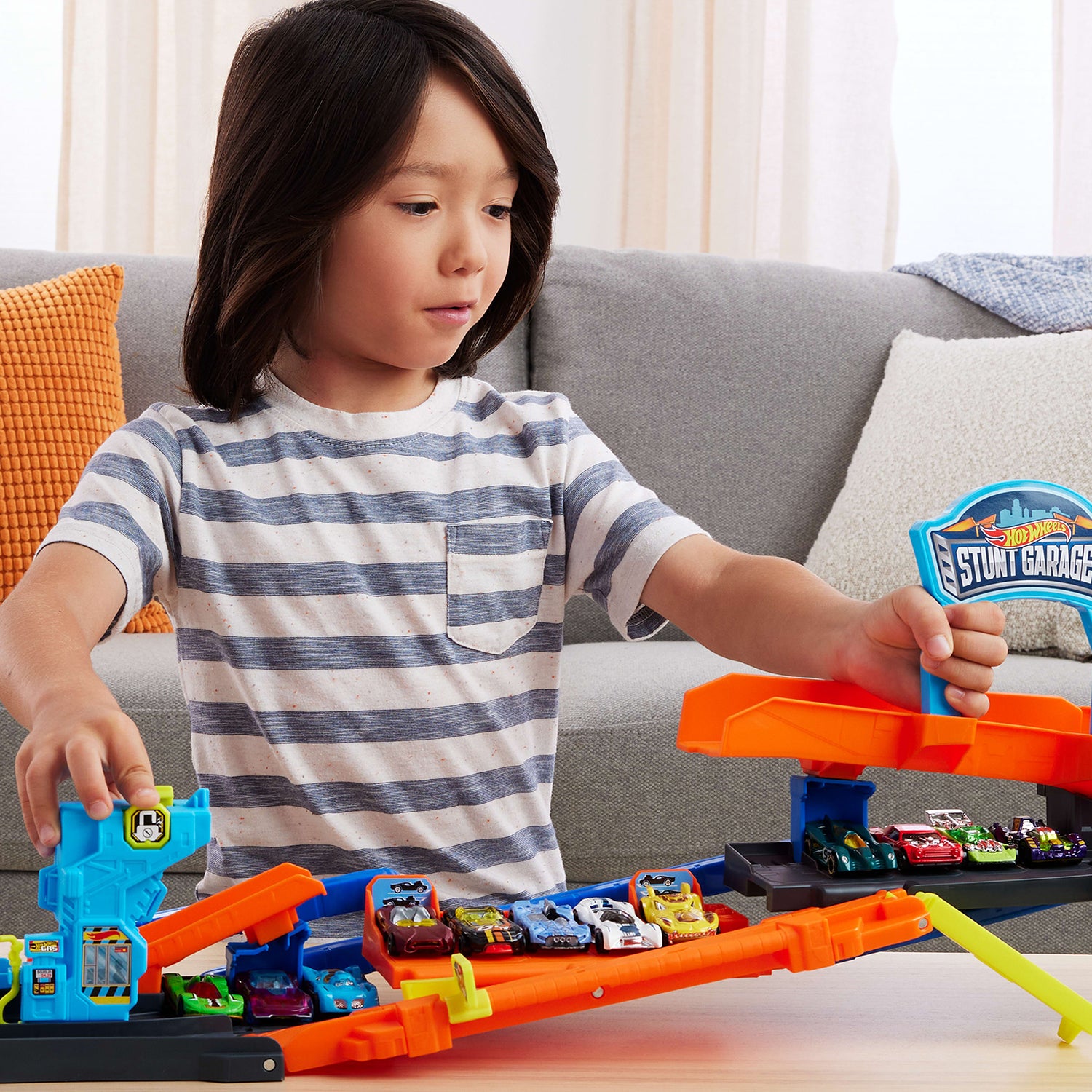 MATTEL - Hot Wheels City Transforming Stunt Garage 2 in 1 con Pista Acrobazie e Macchinina 1:64 4+ Anni